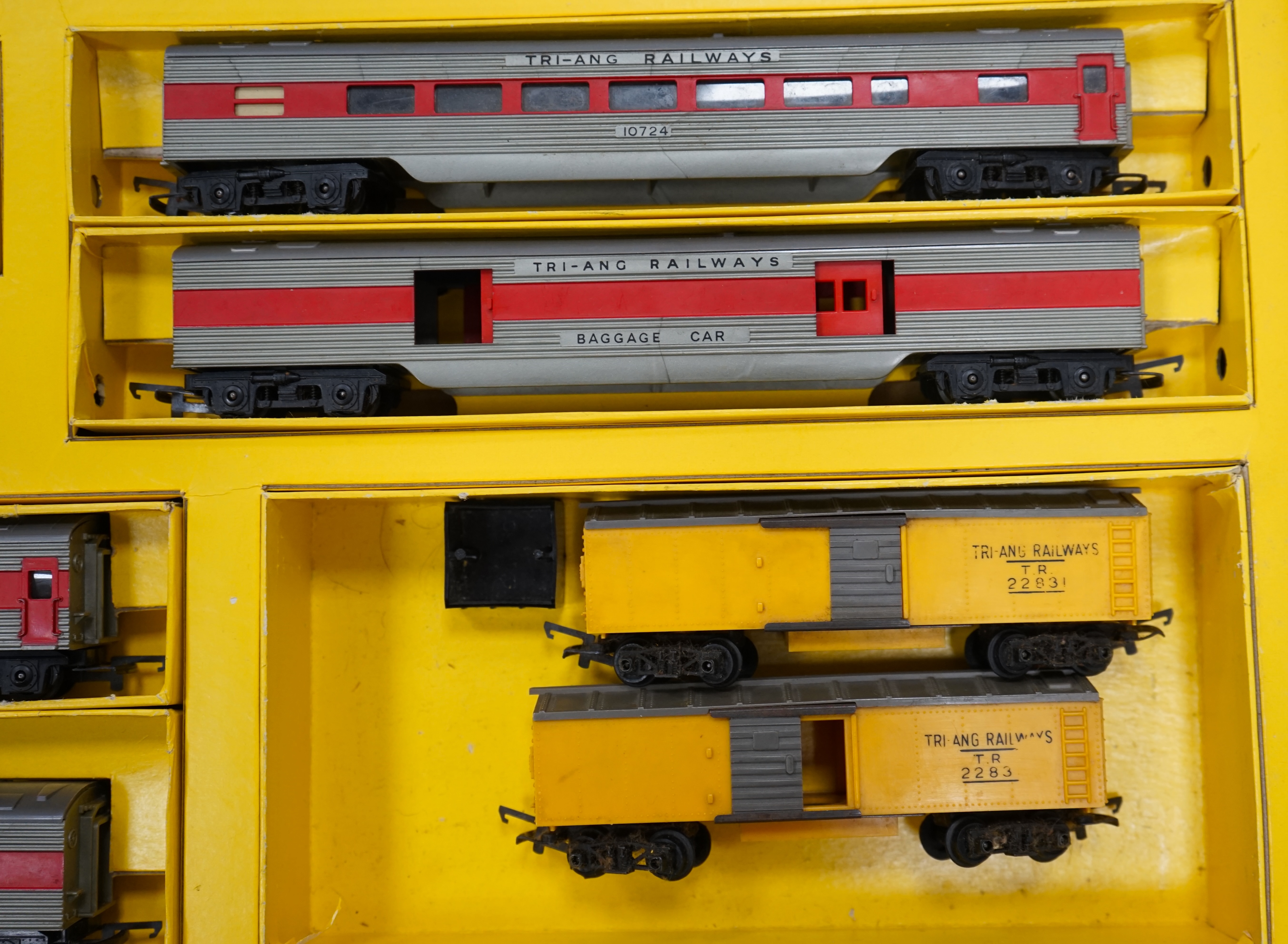 A collection of Hornby Dublo and Tri-ang Railways 00 gauge railway contained within two original boxes; a Hornby Dublo EDG17 Tank Goods Train B.R. set, contents include a BR Standard Class 4, 80054, fourteen tinplate fre